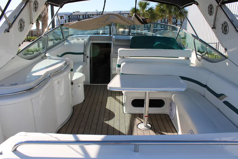 Slide: The Image of 1999 Formula 400 Super Sport boat interior with seating and table. - 14