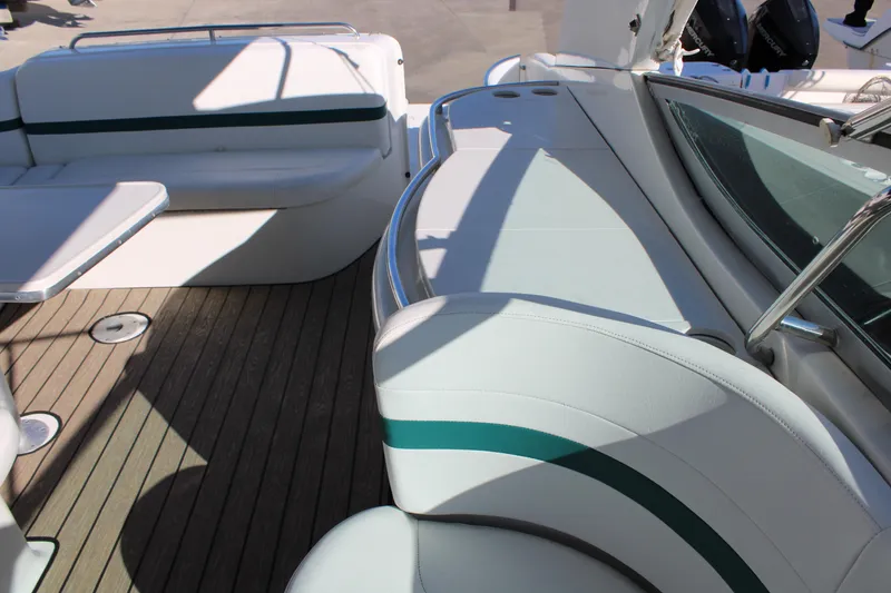 Slide: The Image of 1999 Formula 400 Super Sport boat interior with white and green seating. - 17