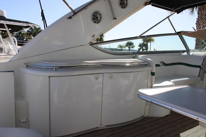 Slide: The Image of 1999 Formula 400 Super Sport yacht interior with seating and storage. - 20