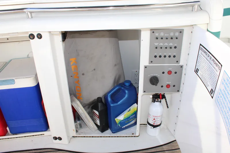 Slide: The Image of 1999 Formula 400 Super Sport storage compartment with control panel, cooler, and supplies. - 22