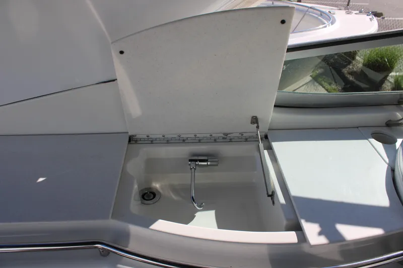 Slide: The Image of Open sink compartment on a 1999 Formula 400 Super Sport boat. - 25