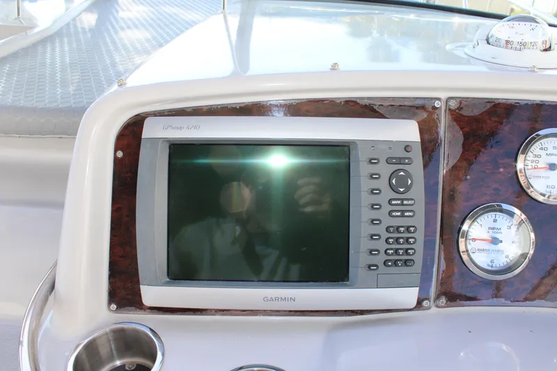 Slide: The Image of Garmin GPS display on the dashboard of a 1999 Formula 400 Super Sport boat. - 29