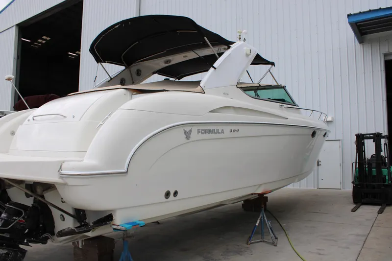 Slide: The Image of 1999 Formula 400 Super Sport boat in dry dock for maintenance. - 3