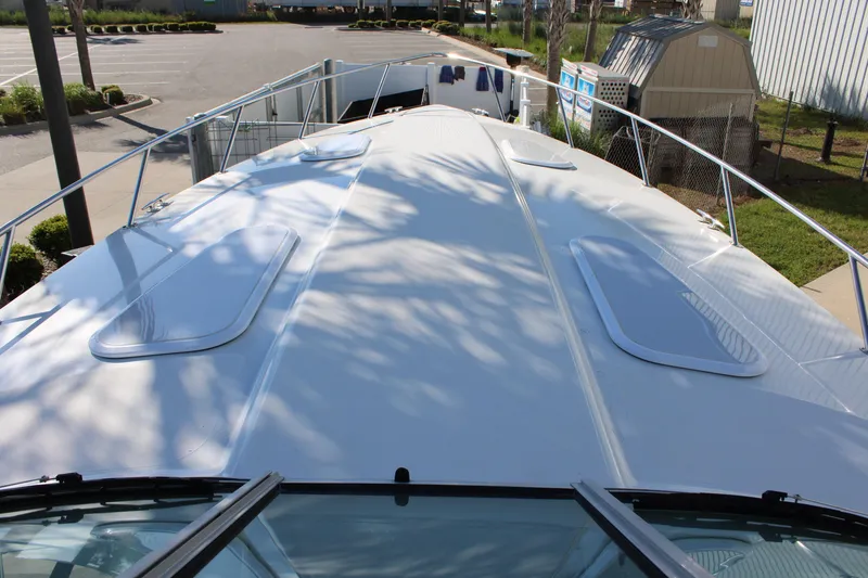 Slide: The Image of 1999 Formula 400 Super Sport boat deck with hatches and railing. - 33