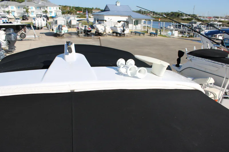 Slide: The Image of 1999 Formula 400 Super Sport boat docked at a marina. - 35