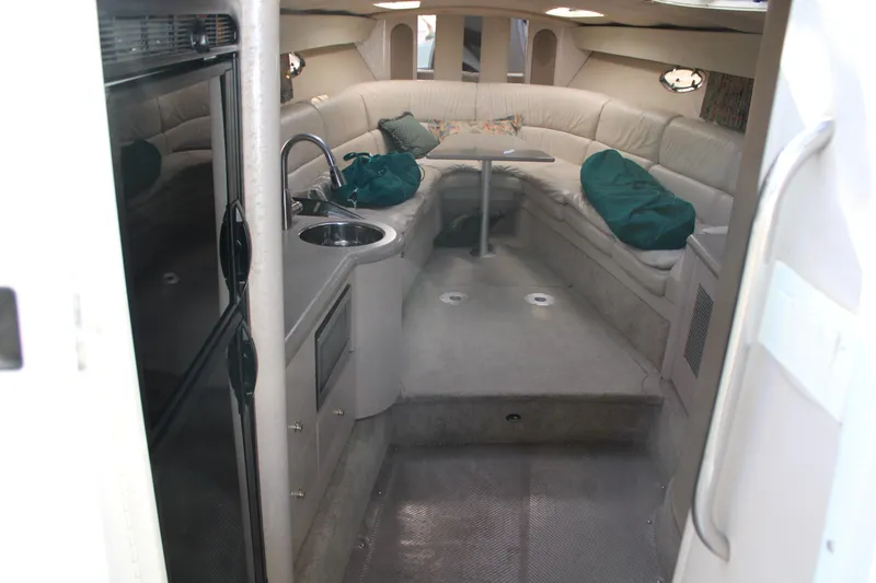 Slide: The Image of 1999 Formula 400 Super Sport boat interior with kitchenette and seating area. - 36