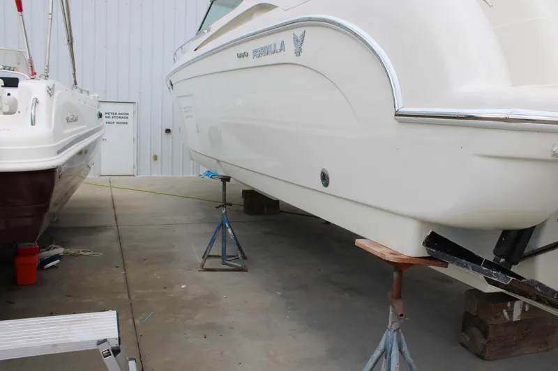 Slide: The Image of 1999 Formula 400 Super Sport boat on stands in a storage facility. - 37