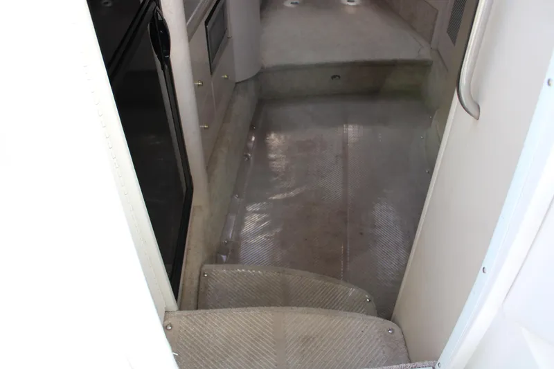 Slide: The Image of Interior cabin steps of a 1999 Formula 400 Super Sport boat. - 38