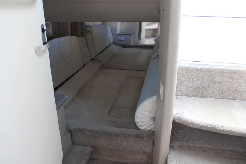 Slide: The Image of Interior cabin of a 1999 Formula 400 Super Sport boat with carpeted flooring. - 40