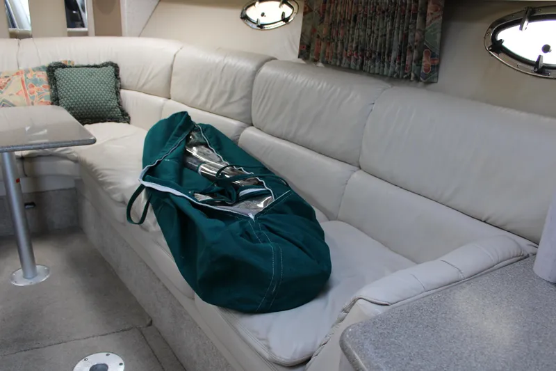 Slide: The Image of 1999 Formula 400 Super Sport interior with white leather seating and green bag. - 43