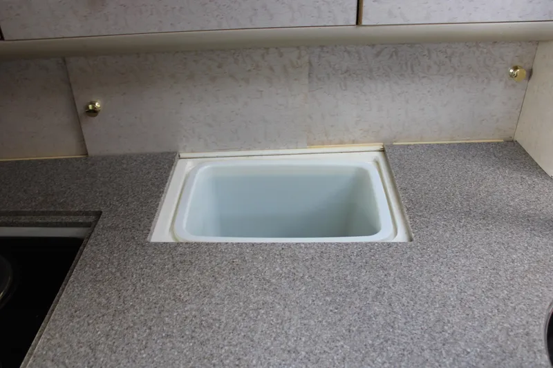 Slide: The Image of 1999 Formula 400 Super Sport kitchen sink with grey countertop. - 47