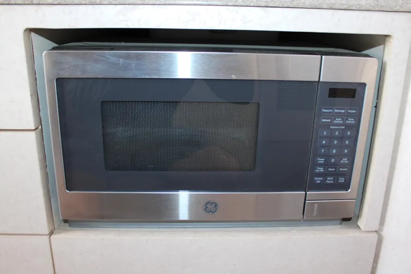 Slide: The Image of Built-in stainless steel microwave in a 1999 Formula 400 Super Sport boat. - 48