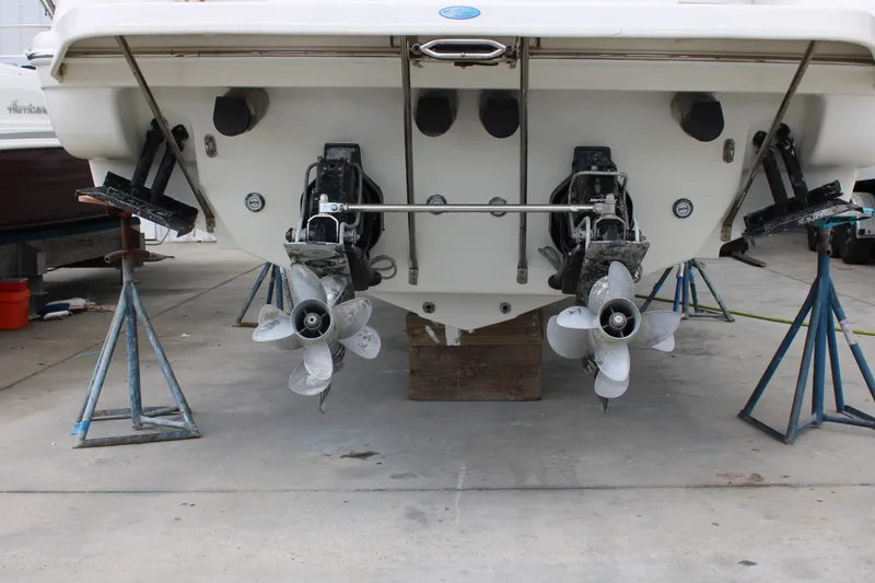 Slide: The Image of 1999 Formula 400 Super Sport boat on stands, showing dual propellers and stern drives. - 5