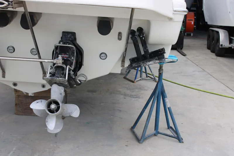 Slide: The Image of 1999 Formula 400 Super Sport boat stern with propeller and support stands. - 7