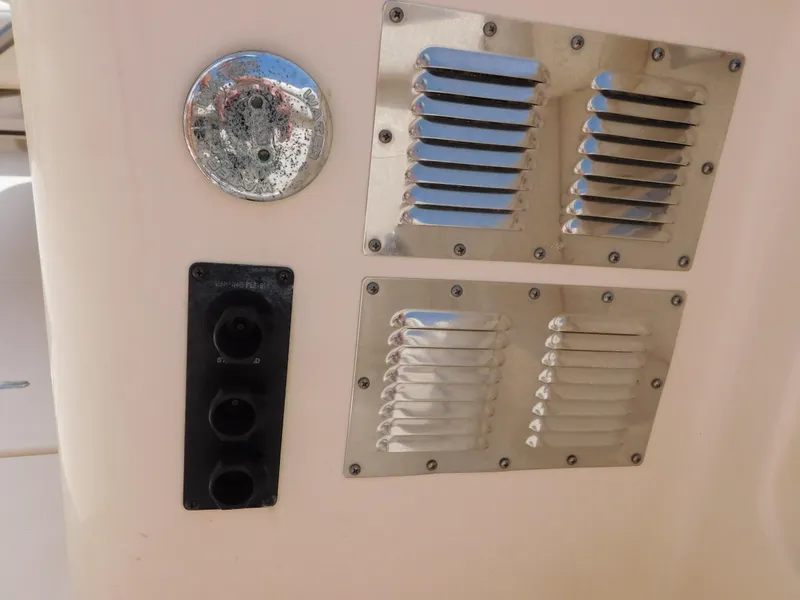 Slide: The Image of 2018 Grady-White Freedom 375 boat ventilation and electrical panel detail. - 12