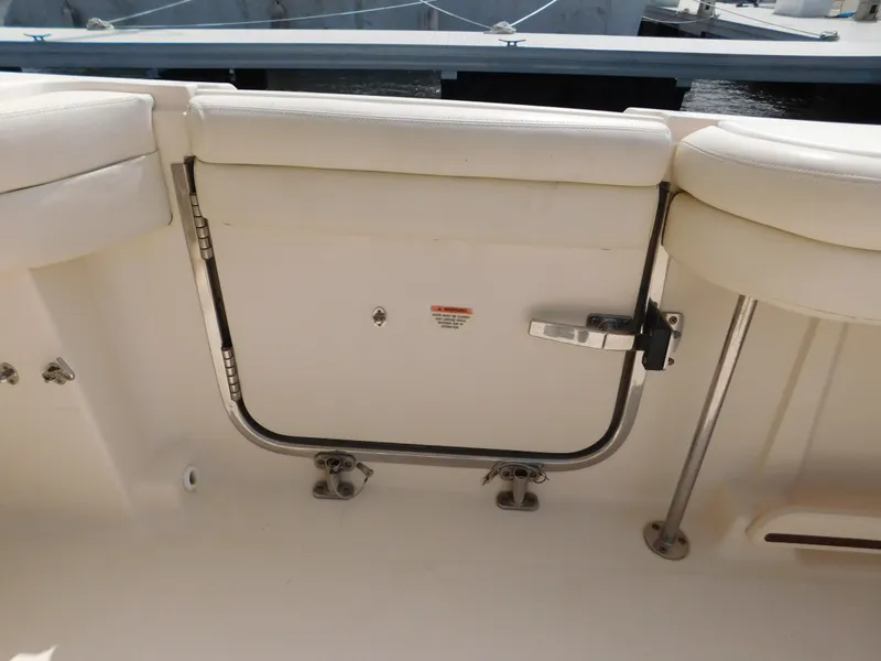 Slide: The Image of 2018 Grady-White Freedom 375 boat interior with white seating and stainless steel fittings. - 16