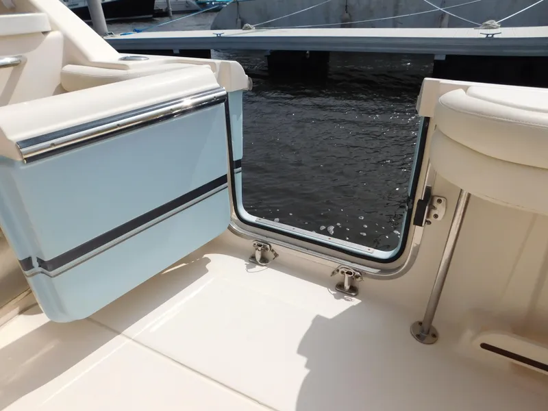 Slide: The Image of 2018 Grady-White Freedom 375 boat interior, open door to water view. - 17