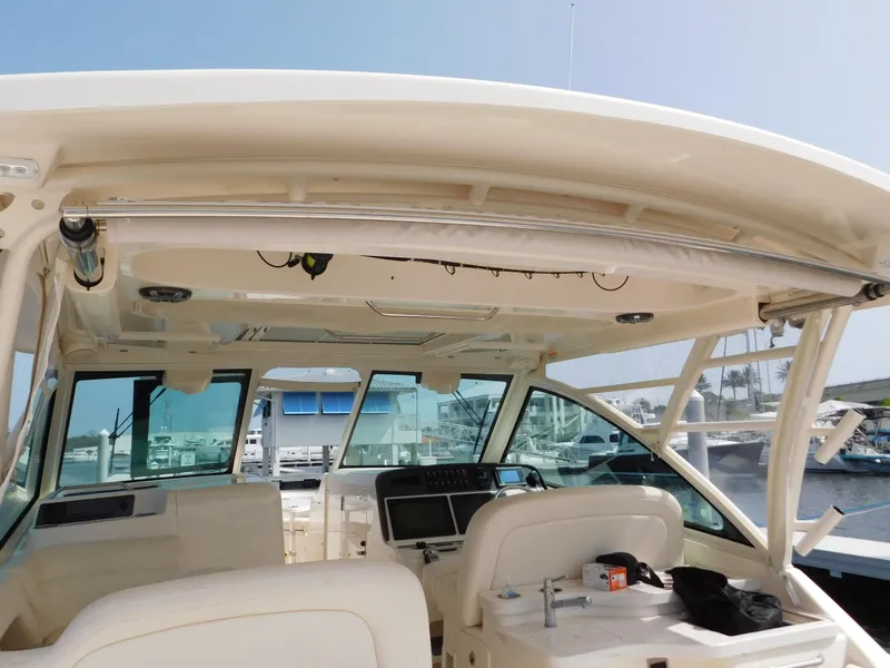 Slide: The Image of 2018 Grady-White Freedom 375 boat interior with helm and seating area. - 24
