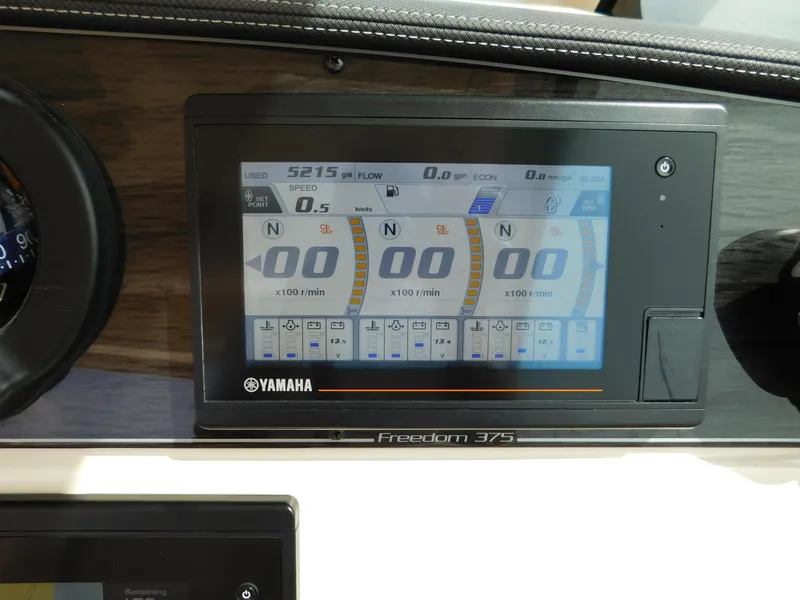 Slide: The Image of Dashboard display of 2018 Grady-White Freedom 375 boat with Yamaha controls. - 33