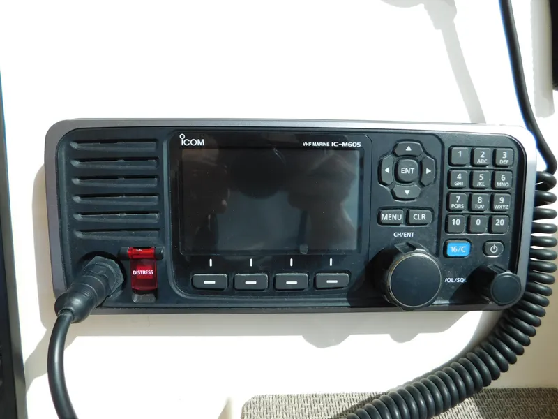 Slide: The Image of VHF marine radio on 2018 Grady-White Freedom 375 boat dashboard. - 36