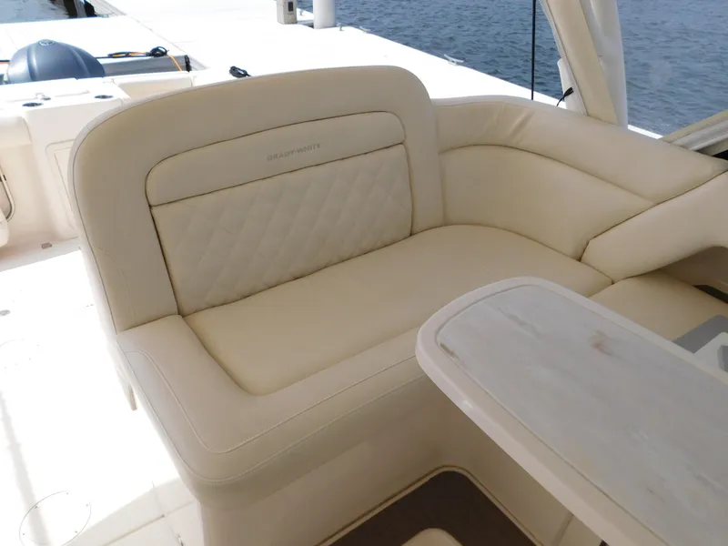 Slide: The Image of Luxurious seating on 2018 Grady-White Freedom 375 boat, featuring cream upholstery and elegant design. - 43