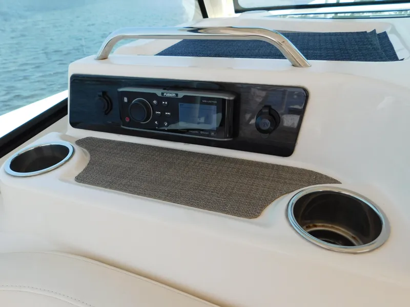Slide: The Image of 2018 Grady-White Freedom 375 boat console with stereo system and cup holders. - 45