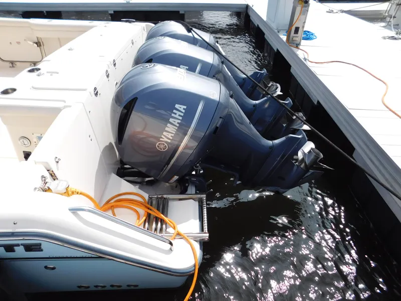 Slide: The Image of 2018 Grady-White Freedom 375 with triple Yamaha outboard engines at dock. - 5