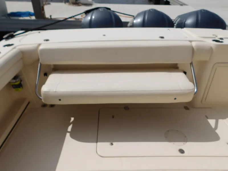 Slide: The Image of 2018 Grady-White Freedom 375 boat seating area with foldable bench and storage. - 8