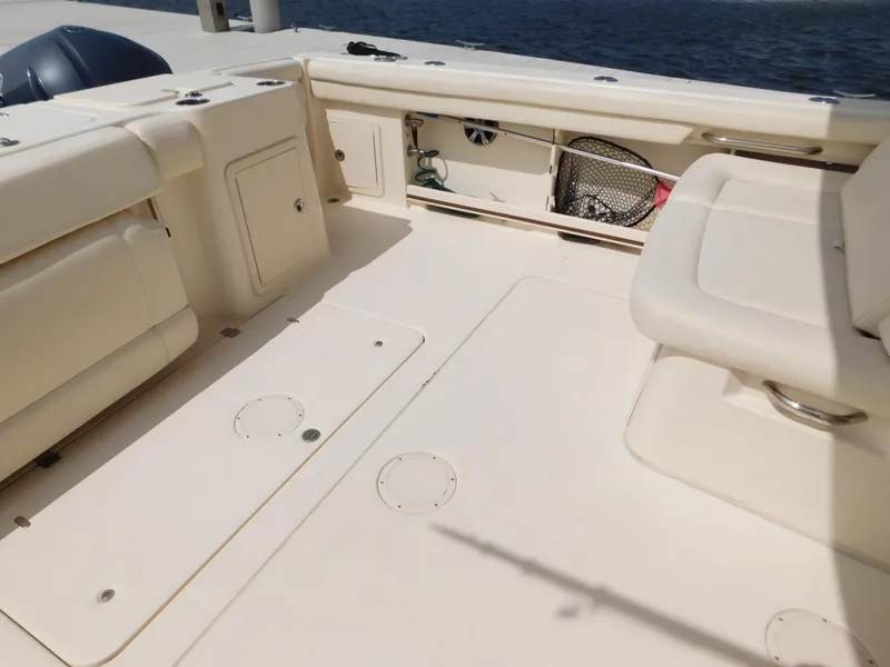 Slide: The Image of 2018 Grady-White Freedom 375 boat interior with seating and storage compartments. - 9