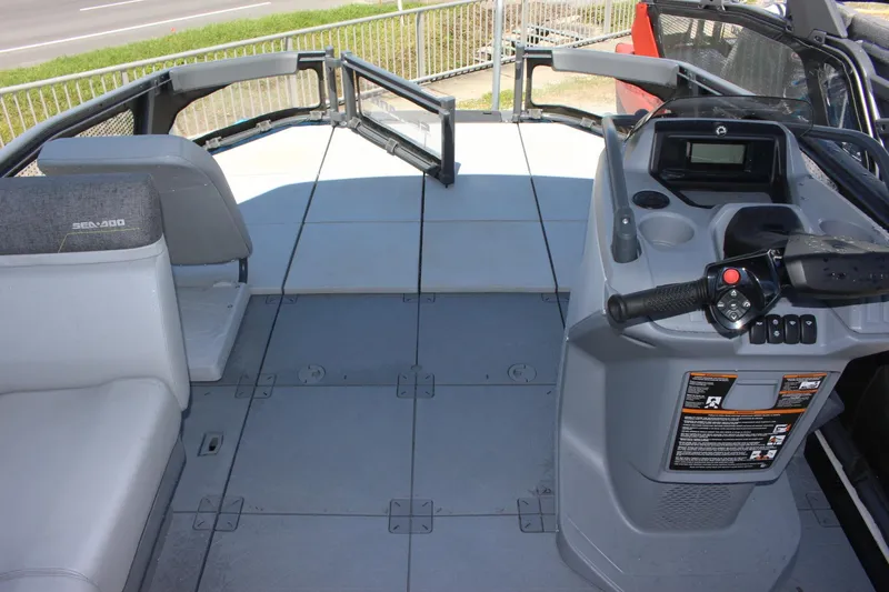 Slide: The Image of 2023 Sea-Doo Switch Sport 18 - 230 HP interior, featuring helm and seating area. - 6
