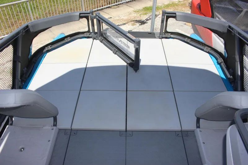 Slide: The Image of 2023 Sea-Doo Switch Sport 18 - 230 HP deck area with seating and safety railing. - 8