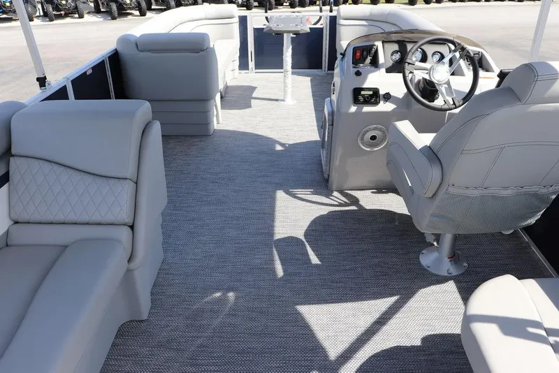 Slide: The Image of 2024 Bennington 21 SSR pontoon boat interior with luxurious seating and modern helm. - 10