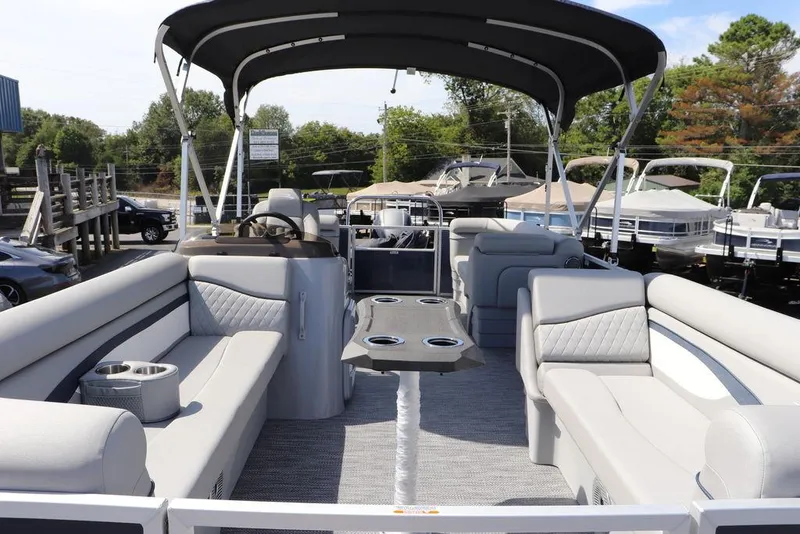 Slide: The Image of 2024 Bennington 21 SSR pontoon boat with spacious seating and canopy. - 3