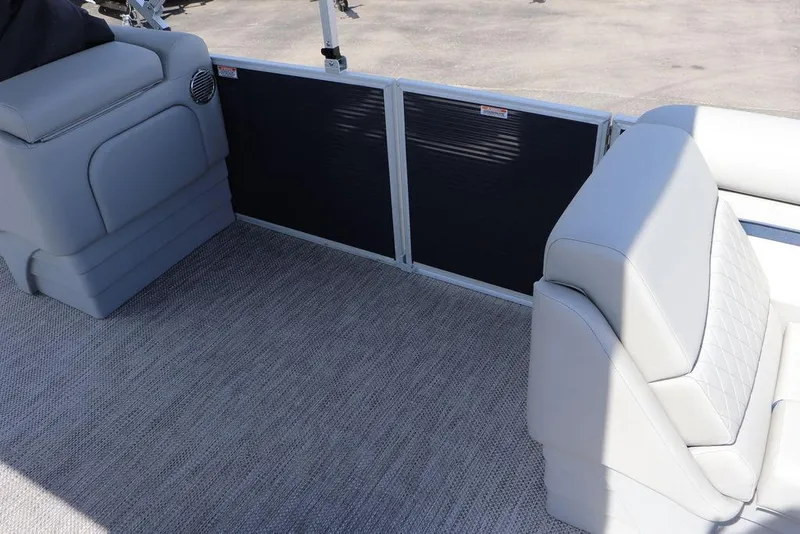 Slide: The Image of 2024 Bennington 21 SSR pontoon boat interior with gray seating and carpet. - 5