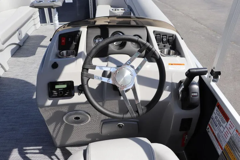 Slide: The Image of 2024 Bennington 21 SSR boat helm with steering wheel and control panel. - 8