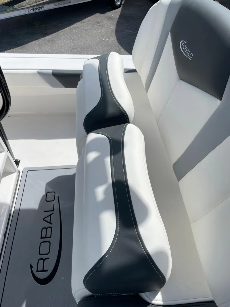 Slide: The Image of 2024 Robalo 226 Cayman boat interior seating with logo. - 16