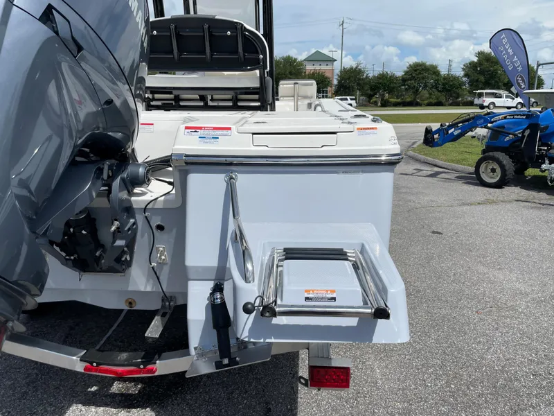 Slide: The Image of 2024 Robalo 226 Cayman boat stern with motor and swim ladder. - 4