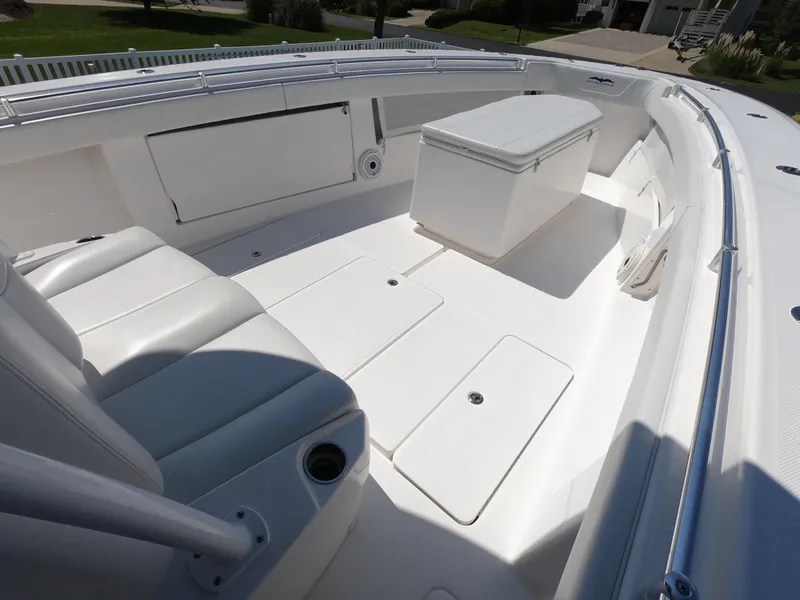 Slide: The Image of 2019 Invincible 39 CC boat interior with seating and storage compartments. - 10