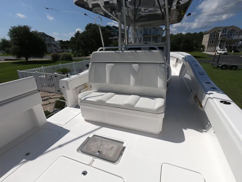 Slide: The Image of 2019 Invincible 39 CC boat with white seating and spacious deck. - 16