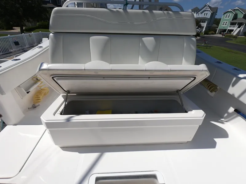Slide: The Image of 2019 Invincible 39 CC boat with open storage compartment on deck. - 18