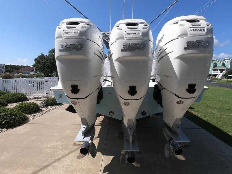 Slide: The Image of Triple Mercury Verado 350 engines on a 2019 Invincible 39 CC boat. - 6