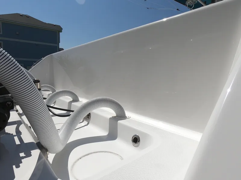 Slide: The Image of 2019 Invincible 39 CC boat interior with hoses and clean white surface. - 8