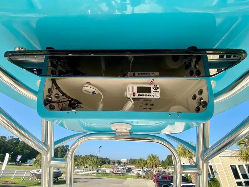 Slide: The Image of 2023 Key West 239 FS boat electronics compartment with radio and controls. - 15