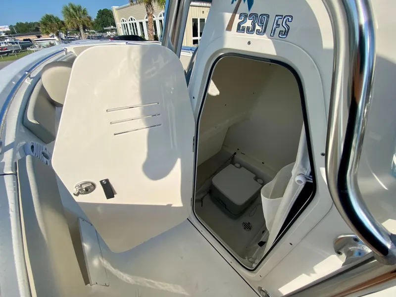 Slide: The Image of 2023 Key West 239 FS boat with open storage compartment. - 17
