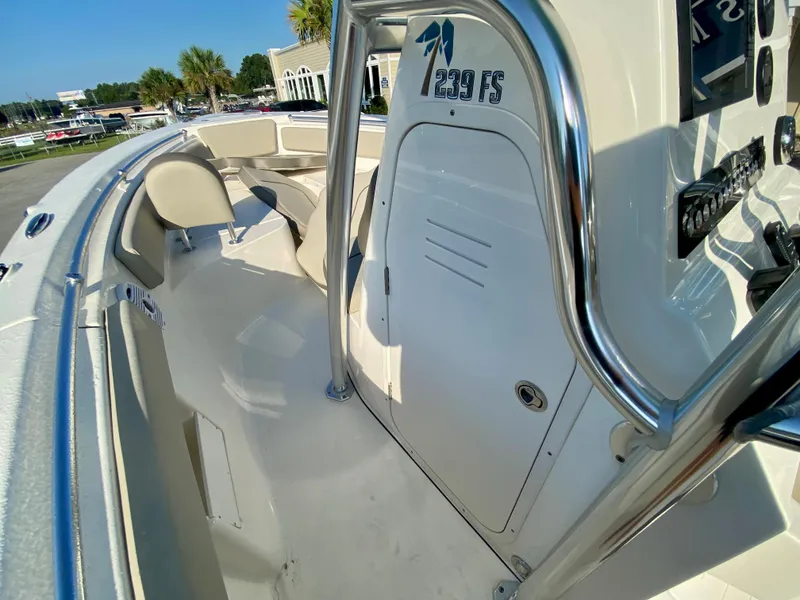 Slide: The Image of 2023 Key West 239 FS boat interior with seating and console. - 18