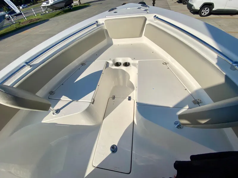 Slide: The Image of 2023 Key West 239 FS boat interior with seating and storage compartments. - 21