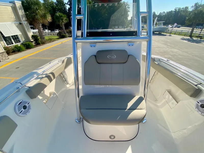 Slide: The Image of 2023 Key West 239 FS boat interior with seating and console. - 23