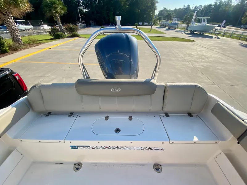 Slide: The Image of 2023 Key West 239 FS boat stern with outboard motor and seating. - 7