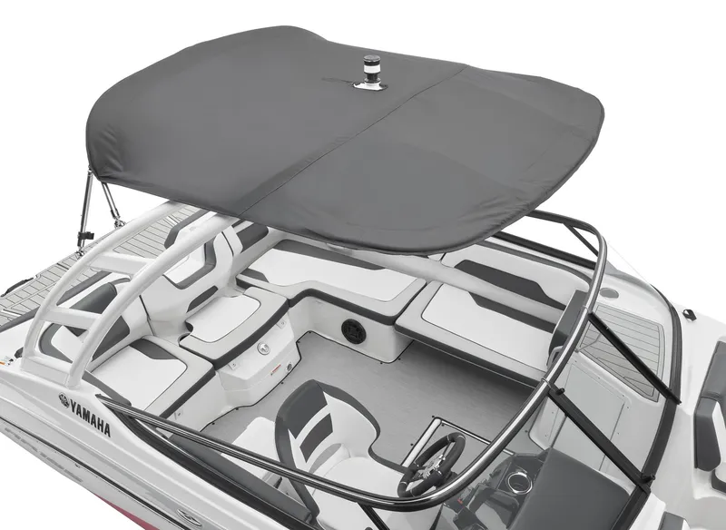Slide: The Image of 2024 Yamaha Boats AR195 with Bimini top and spacious seating. - 4