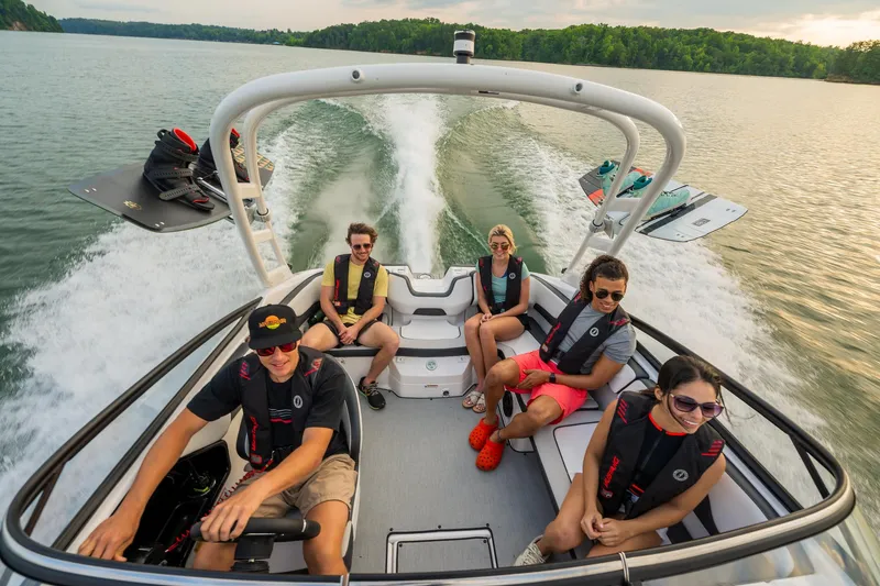 Slide: The Image of 2024 Yamaha Boats AR195 with passengers enjoying a ride on a lake. - 5